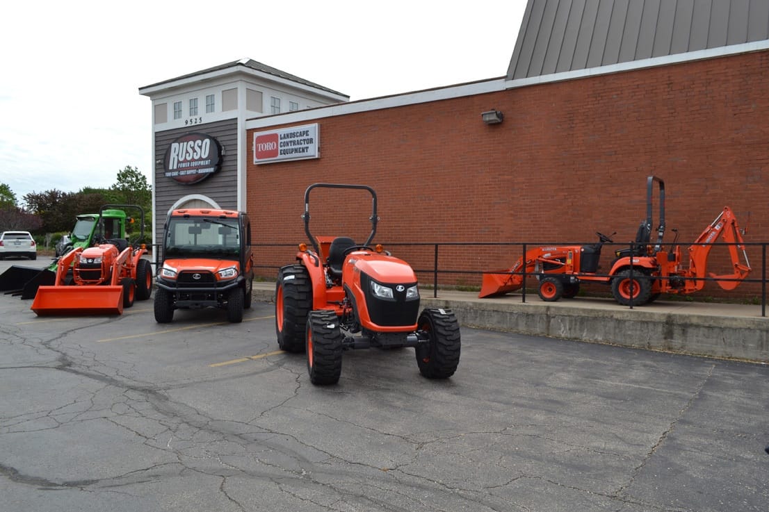 Russo Schiller Park dealership showing Kubota tractor and utility vehicle outside
